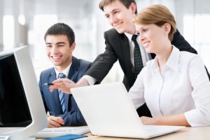 Employees looking at computer