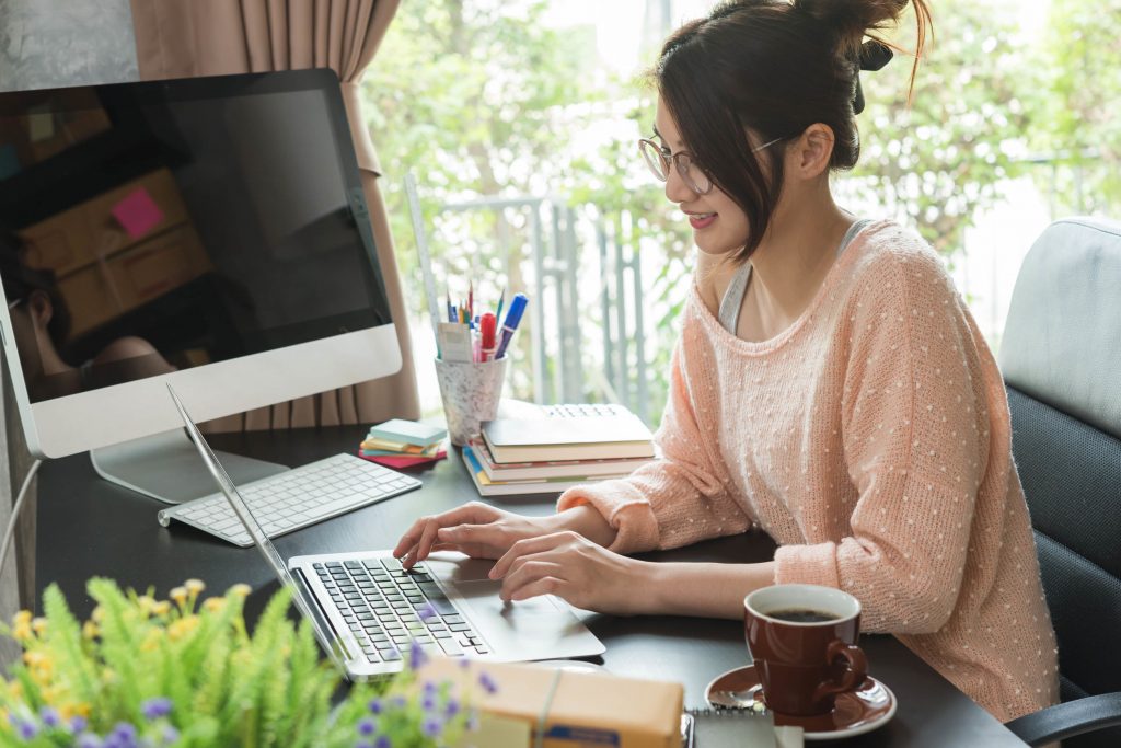 Young beautiful girl working at home, young entrepreneur concept