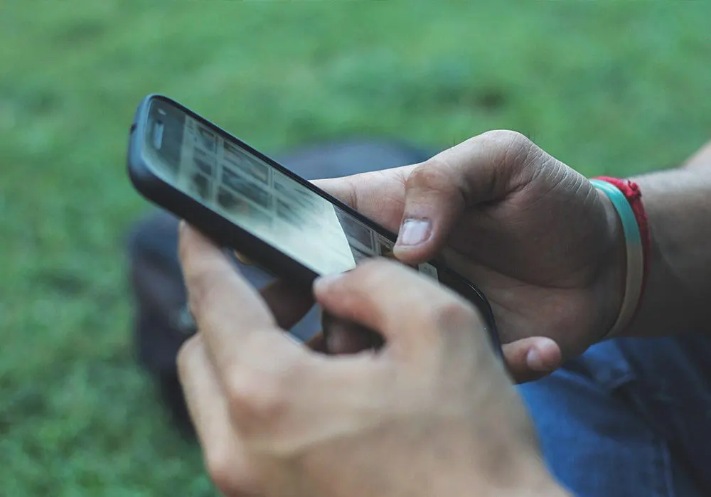 Person looking at images on a smartphone